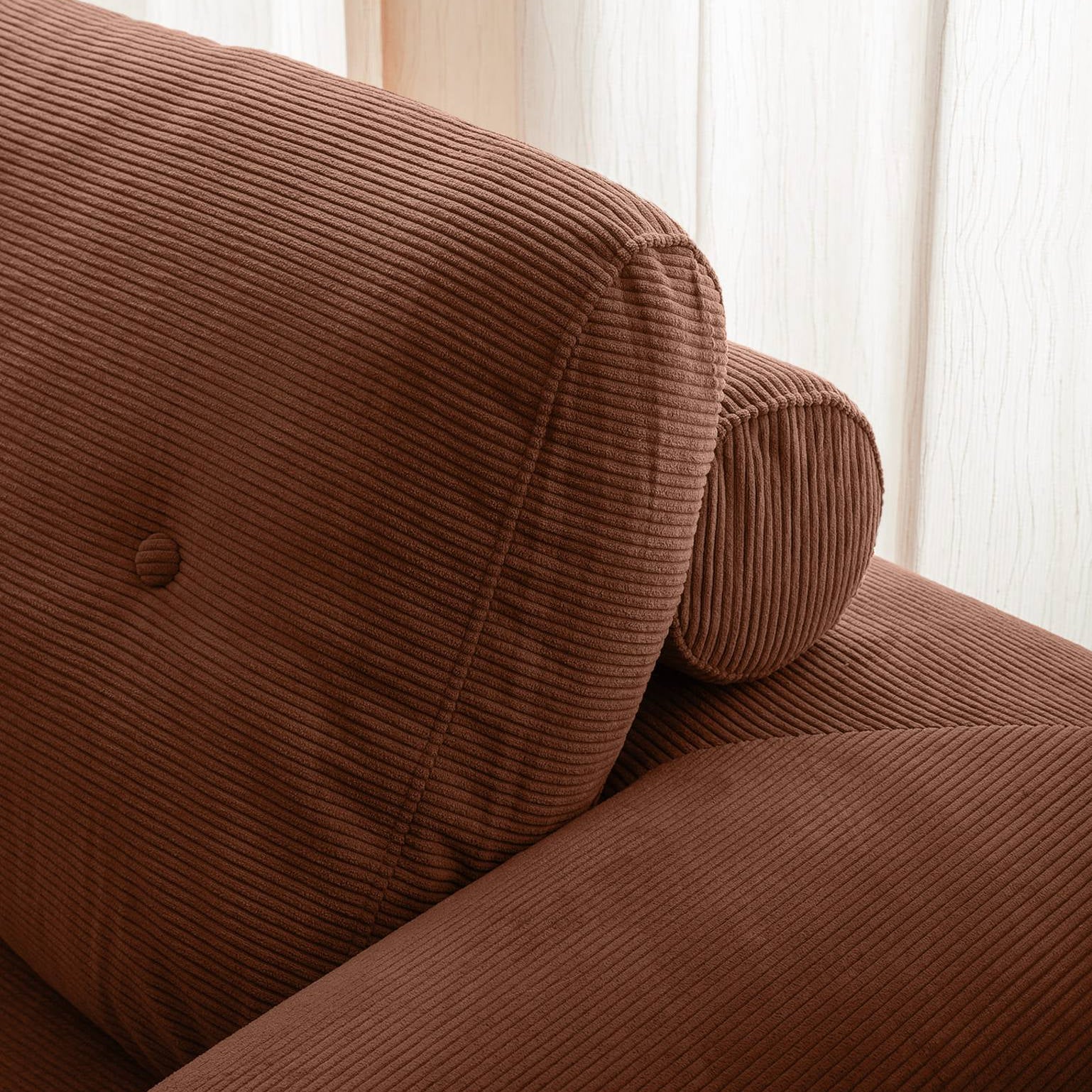 Brown corduroy sofa with a neutral background
