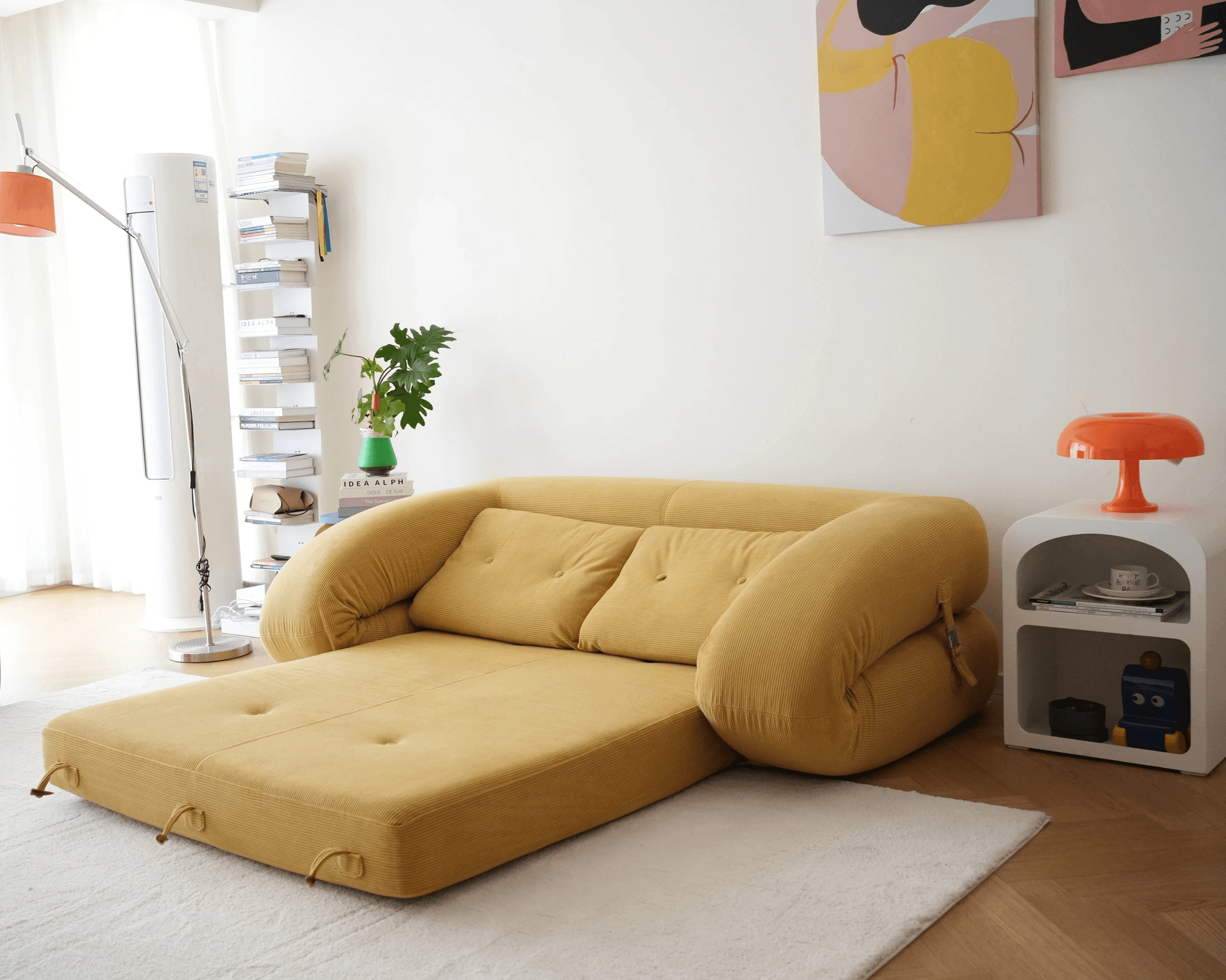 Flippo Sofa Bed in Yellow color – bold sculptural design, soft corduroy fabric, easily converts to bed, modern living room furniture
