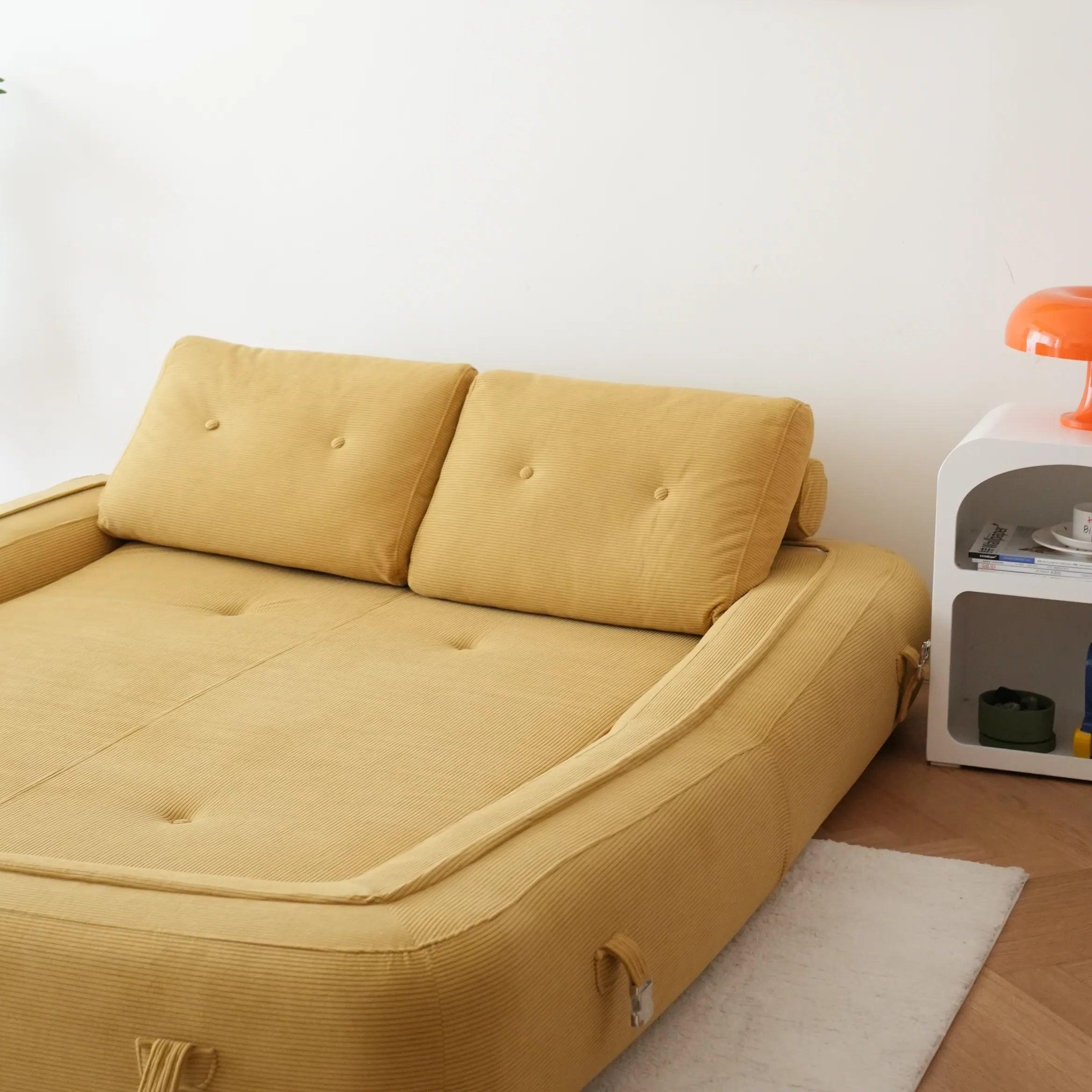 Flippo Sofa Bed in Yellow color – bold sculptural design, soft corduroy fabric, easily converts to bed, modern living room furniture
