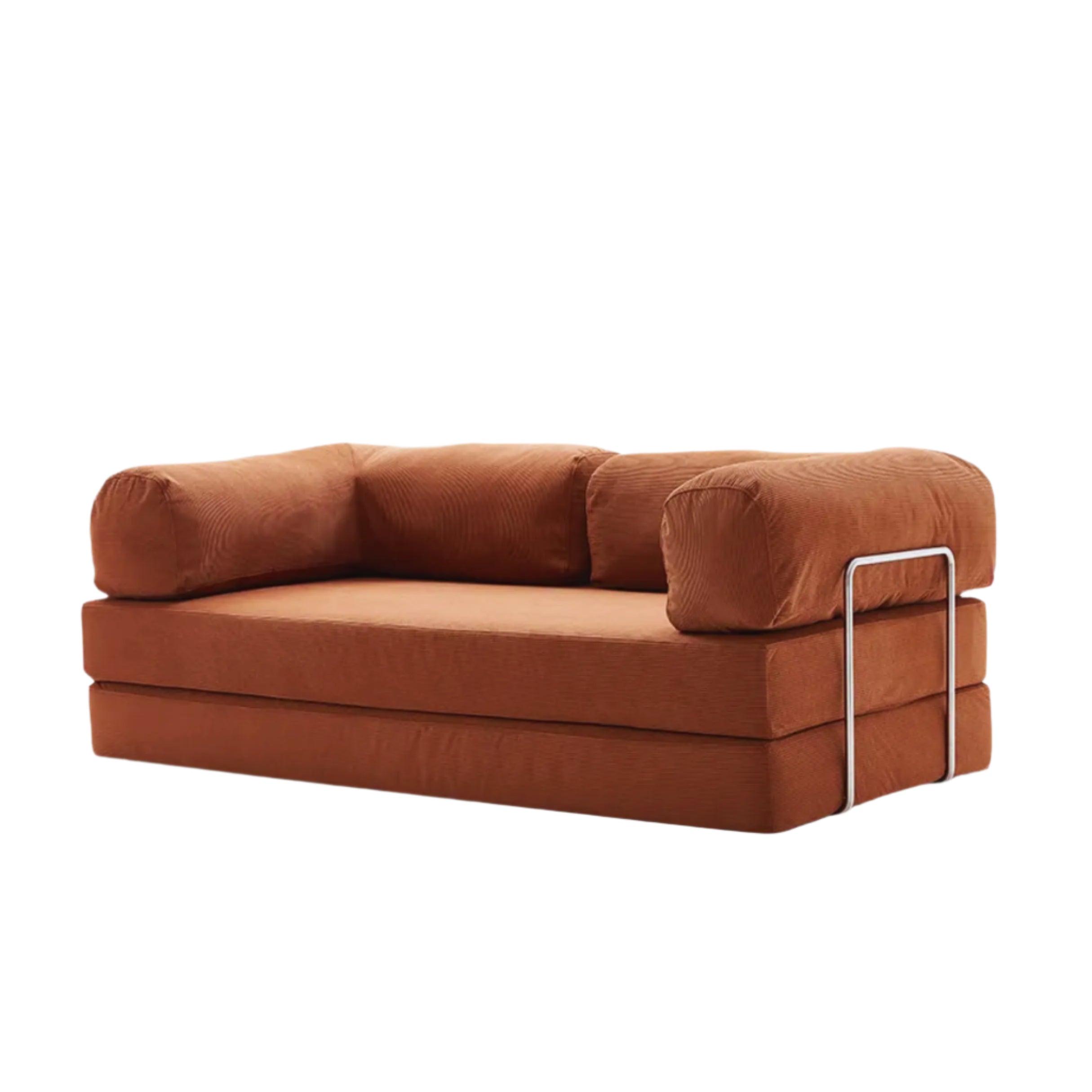 Brown sofa with metal frame on a white background